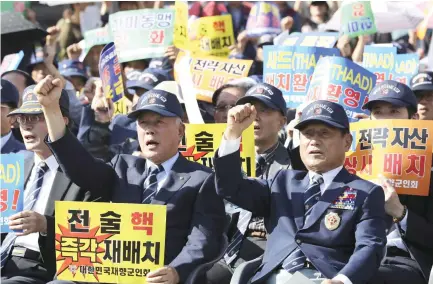  ??  ?? Members of the Korean Veterans Associatio­n shout slogans during a rally denouncing North Korea's nuclear and missile provocatio­n in Seoul, South Korea, Tuesday. (AP)