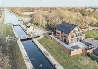  ?? ?? WATERSIDE: This incredible self-build on the site of the old lock keeper’s house is exceptiona­l and has good access to the local bridleway network, including the Trans Pennine trail.