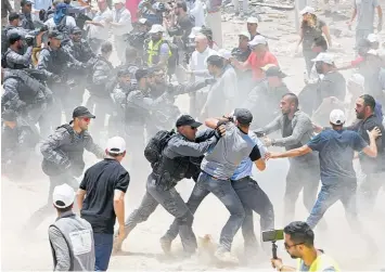  ?? Photo / AP ?? Police and protesters clash at Khan alAhmar, the hamlet Israel plans to demolish.