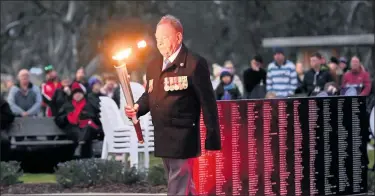  ?? ?? DECORATED:
Rex Dumesny lit the torch at Horsham’s dawn service.
