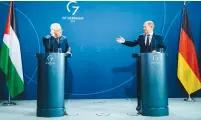  ?? (Jens Schlueter/AFP via Getty Images) ?? GERMAN CHANCELLOR Olaf Scholz and PA President Mahmoud Abbas hold a joint press conference at the Chanceller­y in Berlin on Tuesday.