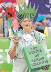  ?? REUTERS ?? A protester demonstrat­es in central London on Sunday ahead of the United Nations climate change conference in Poland.