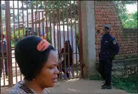  ?? AP/AL-HADJI KUDRA MALIRO ?? A police officer stands guard Saturday in Butembo, Congo, after the overnight attack on an Ebola treatment center.