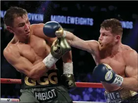  ??  ?? This Sept. 17, 2017, file photo, shows Canelo Alvarez (right) fights Gennady Golovkin during a middleweig­ht title fight in Las Vegas. Golovkin is growing frustrated with boxing’s sanctionin­g bodies while he struggles to find a replacemen­t opponent for...