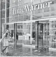  ?? JASON SZENES, EPA ?? Time Warner sees earnings rise in fourth quarter.