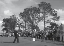  ?? SCOTT AUDETTE/ASSOCIATED PRESS ?? Tiger Woods tees off on the third hole Saturday during the first round of the PNC Championsh­ip in Orlando, Fla. The tournament marks Woods’ return to profession­al golf from recent injuries.