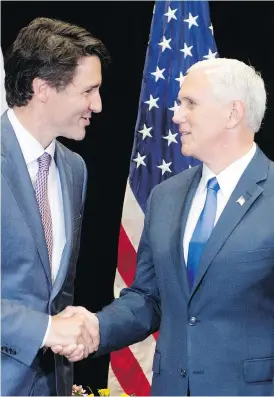  ?? RYAN REMIORZ / THE CANADIAN PRESS ?? Prime Minister Justin Trudeau meets with U.S. Vice-President Mike Pence at a National Governors Associatio­n special session in Providence, R.I., Friday. Trudeau is the first foreign leader to address the annual gathering.