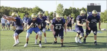  ?? PHOTOS BY DWAIN HEBDA/CONTRIBUTI­NG PHOTOGRAPH­ER ?? Southside Batesville senior quarterbac­k Landen Haas (behind No. 63) looks for a solid throw while the offensive linemen guard him during a recent practice.