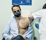  ??  ?? Manly: Kyriakos Mitsotakis, the prime minister of Greece, gets his vaccinatio­n