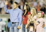  ?? JOHN KENNEY/ THE GAZETTE ?? Former Alouette Ben Cahoon, with his wife, Kim, and daughters, waves during a celebratio­n for him in 2011.