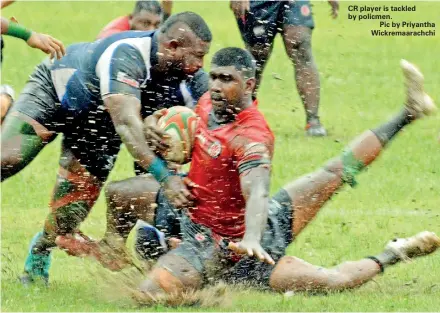  ??  ?? CR player is tackled by policmen.
Pic by Priyantha Wickremaar­achchi