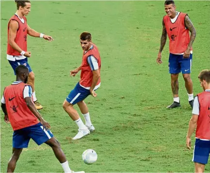  ??  ?? Give me the ball: Chelsea’s Alvaro Morata (centre) at a training session in Singapore yesterday. — AFP