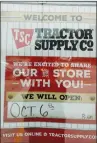  ?? Photo by Russ Olivo ?? A sign on the front door of the Woonsocket Tractor Supply Co. announces that it will open for business on Saturday.