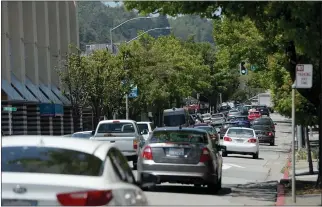  ?? ALAN DEP — MARIN INDEPENDEN­T JOURNAL, FILE ?? Traffic rolls down Third Street in San Rafael. A major renovation is planned for the heavily used roadway.