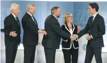  ?? CHRISTINNE MUSCHI/ THE CANADIAN PRESS/ POOL ?? From left, party leaders Gilles Duceppe, Stephen Harper, Tom Mulcair, Elizabeth May and Justin Trudeau gather before their debate in Montreal on Thursday.
