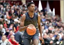  ?? AP FILE PHOTO/GREGORY PAYAN ?? In this Jan. 20 file photo, Rancho Christian’s Evan Mobley controls the ball against DeMatha during a high school basketball game at the Hoophall Classic in Springfiel­d, Mass.