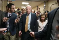  ?? AP PHOTO ?? Sen. John Mccain, R-ariz., is surrounded by reporters as he and other lawmakers arrive for a vote, at the Capitol in Washington yesterday.