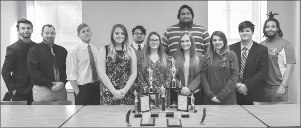  ??  ?? Debate: Members of the UAM debate and forensics team display their team and individual trophies from the Southern Forensics Championsh­ip Tournament. Pictured, from left, are Hunter Cook, Kyle Hargis, Dylan Hargis, Grace Nash, Zach Young, Abby...