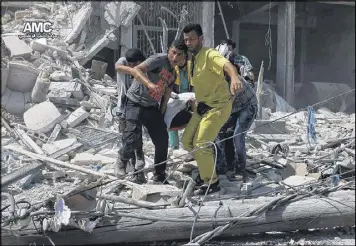  ?? ALEPPO MEDIA CENTER ?? Syrians carry a victim after bombs fell on the Bab al-Nairab neighborho­od in Aleppo, Syria, on Saturday.