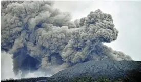  ?? /Reuters ?? Deadly blast: Mount Marapi in West Sumatra spews volcanic ash after erupting on Sunday. Three survivors were found on Monday along with the bodies of 11 climbers.