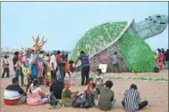  ?? R. SATISH BABU / AFP ?? An installati­on depicting a sea turtle made from used plastic bottles is displayed at Edward Elliot’s Beach in Chennai, India, on June 25 to increase public awareness about plastic pollution.