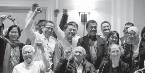  ??  ?? Seated from left: Luis Jalandoni, representa­tive of the communist movement the National Democratic Front of the Philippine­s, Fidel Agcaoili, Communist rebel negotiator, and Norwegian Special Envoy Elisabeth Slattum celebrate after signing a joint statement on what has been achieved during the third round of talks on January 25, 2017 in Rome, Italy before President Rodrigo Duterte terminated the formal talks. PHILSTAR.COM