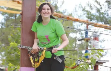  ?? (Zichron Menachem) ?? ROMY PARTICIPAT­ES in a ropes course activity.