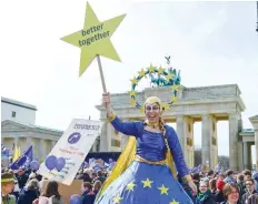  ?? — AFP ?? A woman dressed as Europa attends the ‘March For Europe’ demonstrat­ion in Berlin on Saturday.