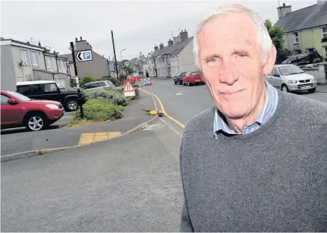  ??  ?? Councillor Peter Rogers has called for a speeds resolution to parking issues in Newborough