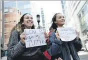  ?? JOSEPH PREZIOSO AFP/Getty Images ?? MACKENZIE THOMAS, left, and Vivi Bonomie jab at Lori Loughlin while she faced charges in Boston.