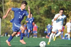  ?? H John Voorhees III / Hearst Connecticu­t Media ?? Abbott Tech’s Michael Candido (21) moves the ball ahead of New Milford’s Yousef Eltoukhy during a boys soccer game on Thursday at Broadview Middle School in Danbury.