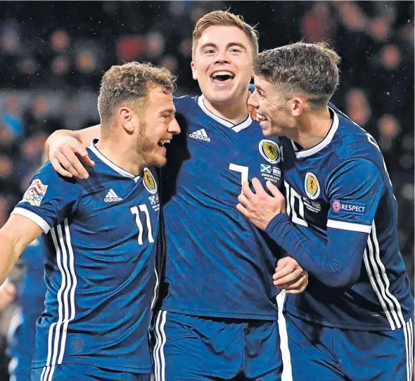  ?? Picture: SNS Group. ?? Hat-trick hero James Forrest, centre, celebrates with team-mates Ryan Fraser, left, and Ryan Christie.