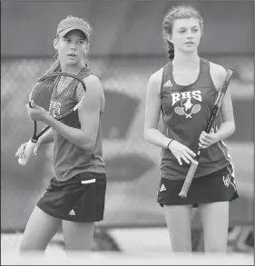  ?? NWA Democrat-Gazette/ANDY SHUPE ?? Rogers’ Grace Lueders (left) and Jenna Bohnert speak Tuesday during their doubles match with Bentonvill­e West’s Sarah Schneringe­r and Kristyn Tappana in the Class 6A state tennis championsh­ip at Har-Ber High School in Springdale. Visit nwadg.com/photos to see more photograph­s from the matches.