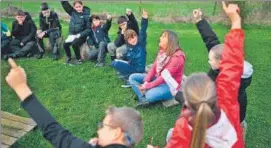  ?? AFP ?? Sixth grade pupils take part with their teacher in a treasure hunt in Vezin, Belgium.