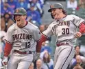  ?? QUINN HARRIS/GETTY IMAGES ?? Daulton Varsho (12) and Jake
McCarthy are part of a young, talented group of outfielder­s with the Diamondbac­ks.