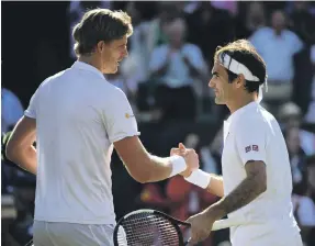  ?? Getty ?? Kevin Anderson shakes hands with Roger Federer after coming from two sets down to beat the seven-time major winner at Wimbledon in July