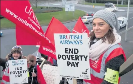  ??  ?? BA crew at Heathrow Airport strike against ‘poverty pay’