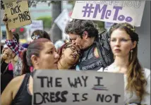  ?? DAVID MCNEW / GETTY IMAGES ?? Demonstrat­ors participat­e in the #MeToo Survivors’ March in response to several high-profile sexual harassment scandals on Nov. 12 in Los Angeles. The protest was organized by Tarana Burke, who created the viral hashtag #MeToo.