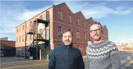  ??  ?? Mark Griffiths and Duncan Alexander outside the new brewery on Bellfield Street.