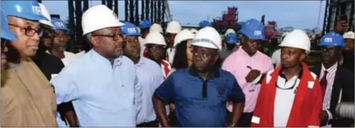  ??  ?? Executive Secretary, NCMB, Engnr Simbi Wabote congratula­ting the Group Managing Director, MG Vowgas Nig Ltd, Mr. Godwin Izomor, after the tour of the Vowgas fabricatio­n and Shipyard, in Port Harcourt… recently