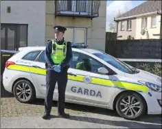  ??  ?? A garda on duty at the scene in the Ashbrook estate.