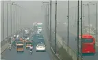  ?? AP ?? Vehicles drive on a highway as smog envelops an area of Lahore on Wednesday. —