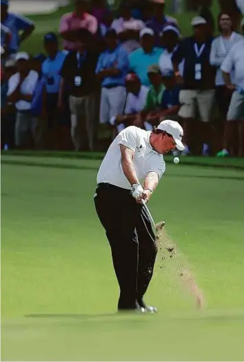  ?? AP ?? Phil Mickelson hits from the fairway on the third hole during the second round of play at the Tour Championsh­ip golf tournament at East Lake Golf Club on Friday.
