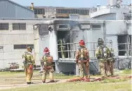  ?? Bryan Fire Department ?? Firefighte­rs in Bryan Texas, stand outside the city’s power plant after an explosion and fire on April 29, 2014. Earle Robinson, 60, and other employees were doing maintenanc­e work at Bryan Texas Utilities Power Plant, which is located about 100 miles...