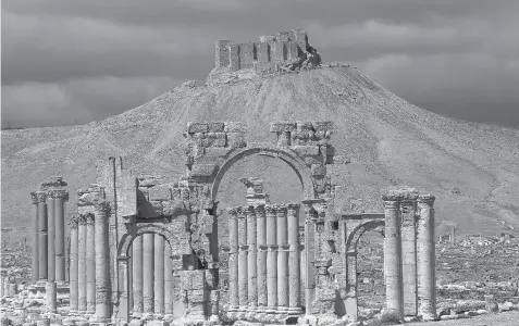  ?? JOSEPH EID/AFP/Getty Images files ?? ISIL fighters this week seized control of the ancient Syrian city of Palmyra, northeast of Damascus, putting the world heritage site at risk of destructio­n.