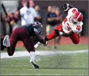  ?? Arkansas Democrat-Gazette/THOMAS METTHE ?? Cabot running back TJ Rogers (right) gets tripped up by Benton cornerback Kelby Caffery during the first quarter of Benton’s 5641 win on Friday at Panther Football Stadium in Benton.