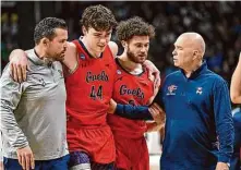  ?? Hans Pennink/Associated Press ?? St. Mary’s coach Randy Bennett, right, will have a hard time replacing the likes of Alex Ducas (44) and Logan Johnson.