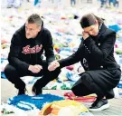  ??  ?? Emotion: Striker Jamie Vardy and his wife Rebekah laid a wreath yesterday