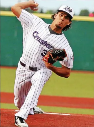  ?? RANDY MEYERS — THE MORNING JOURNAL ?? Crushers starting pitcher Juan Caballero delivers a pitch during the fourth inning against Florence.