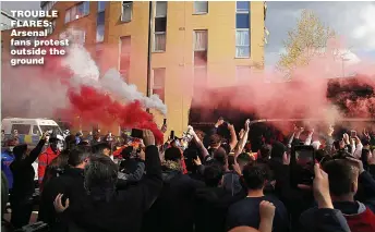  ??  ?? TROUBLE FLARES: Arsenal fans protest outside the ground